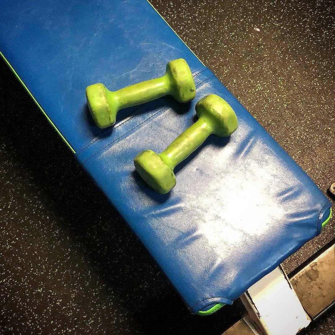 Barbell rack and free weights on the training floor at Xtreme Fitness of Lexington, SC